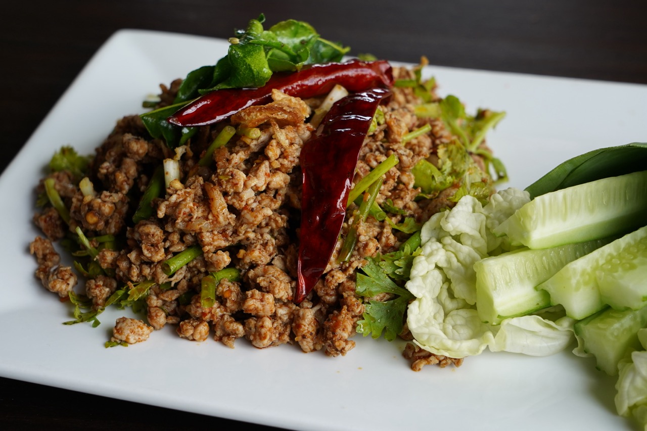 Laab Moo Sukhothai — minced pork salad with dried chillies, fresh herbs, and cucumber