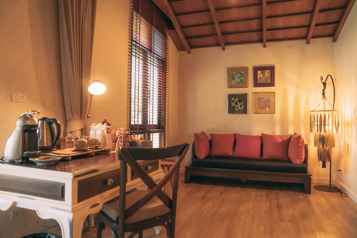 Suite living area with artisan furnishings and soft lantern light